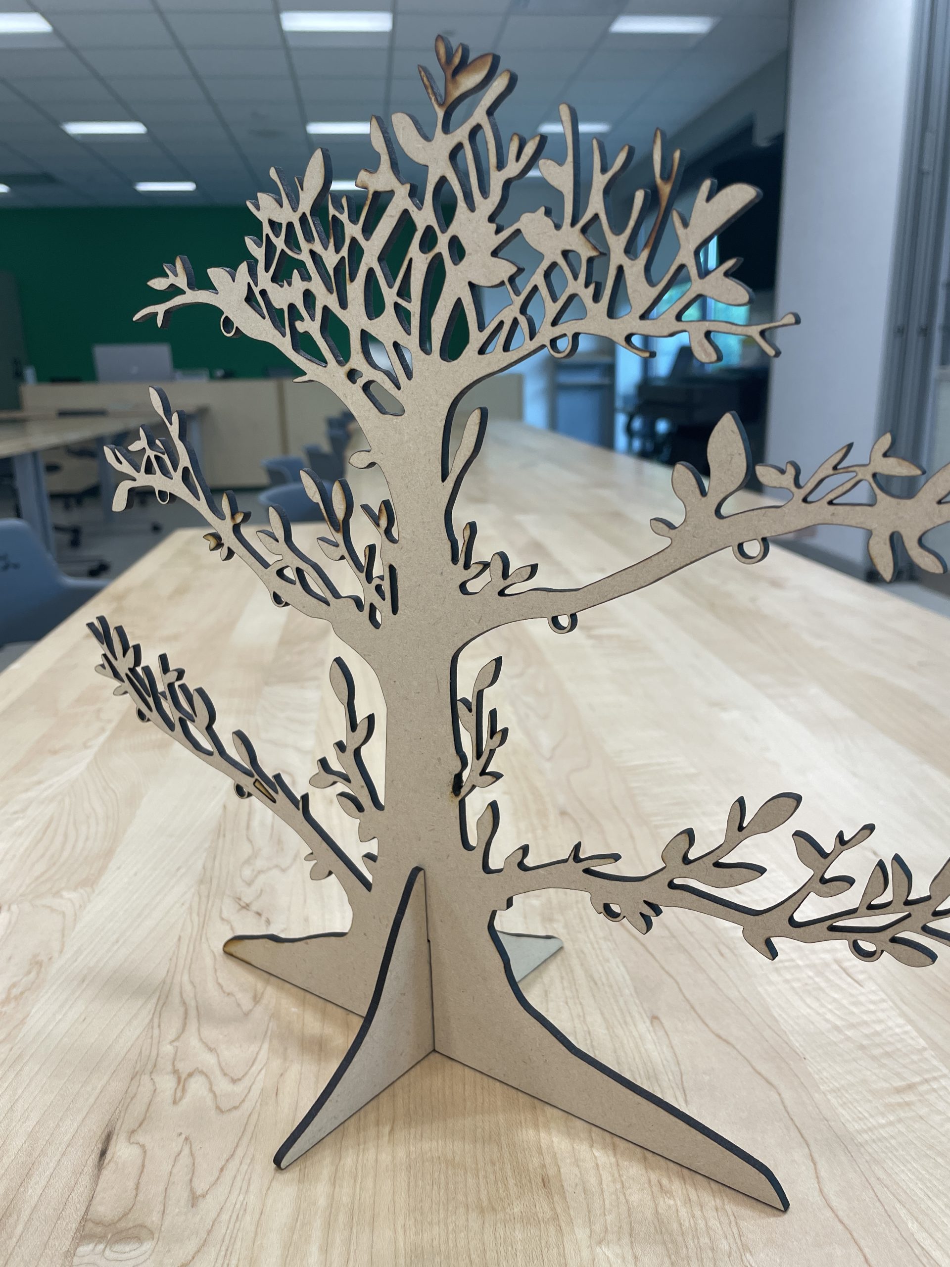Cut-out of a tree made into a standing table decoration.