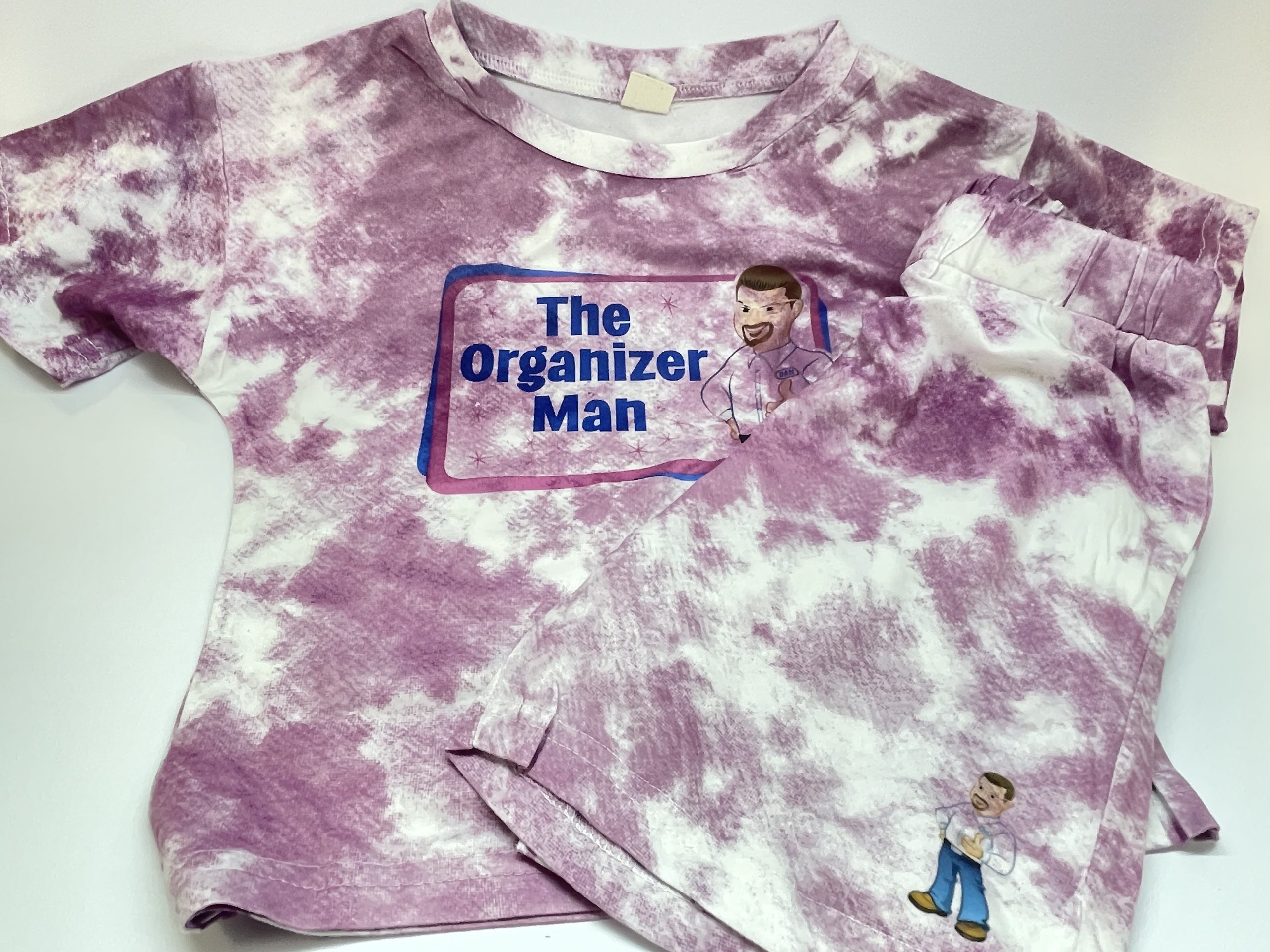 Purple and white tie-dyed t-shirt and shorts with The Organizer Man logo.