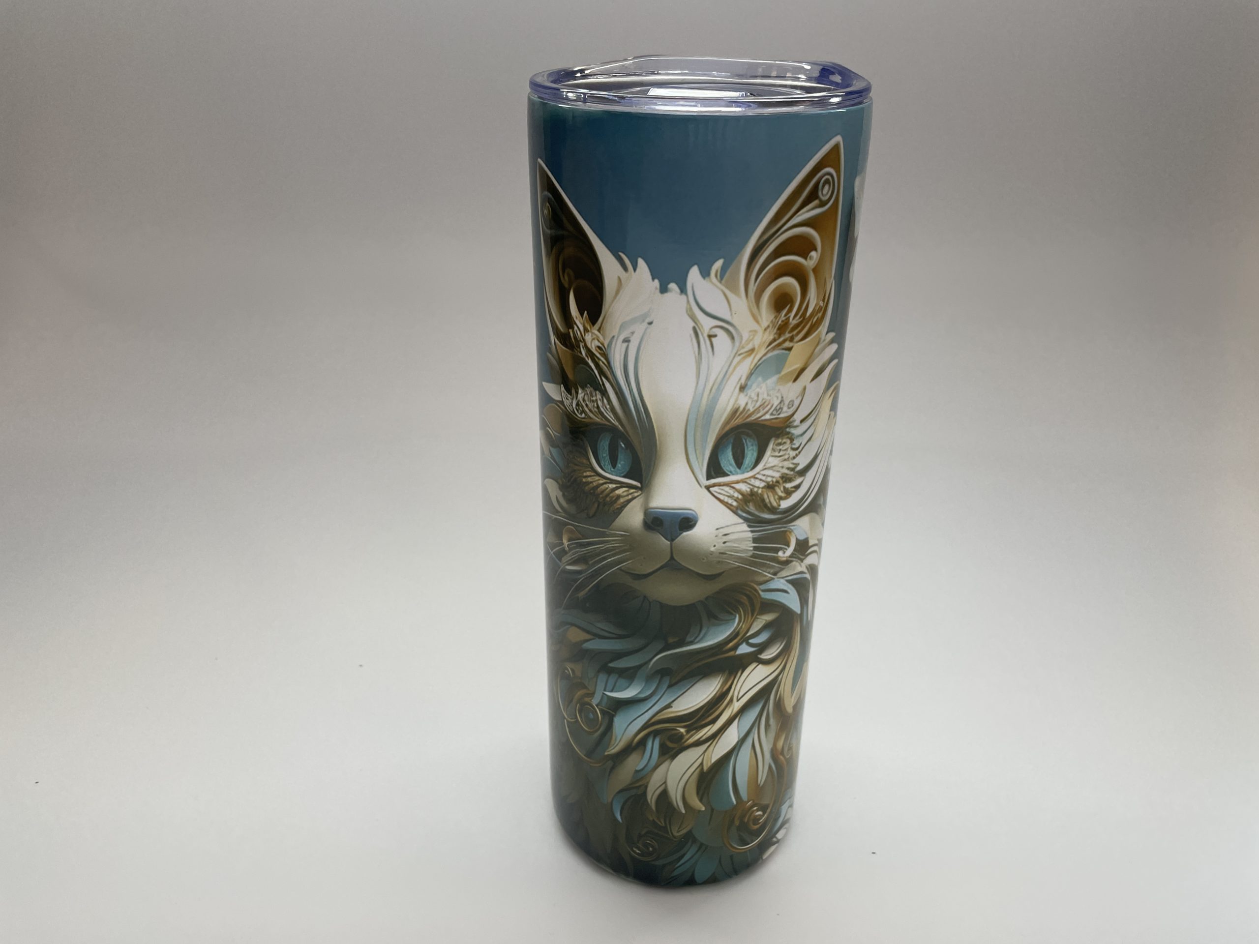 Blue metal tumbler with an image of a white cat.